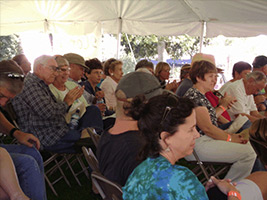 Photo of audience enjoying storytelling in the Festival's Main Tent.